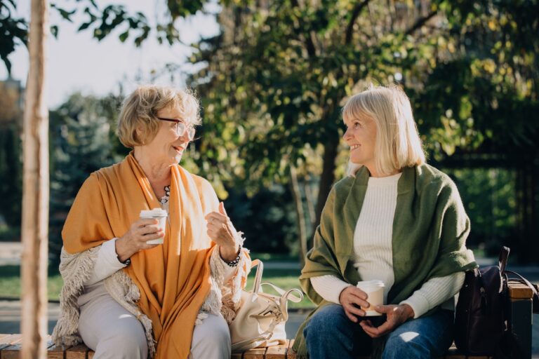 Two,Senior,Women,Sharing,A,Moment,Of,Friendship,,Talking,And