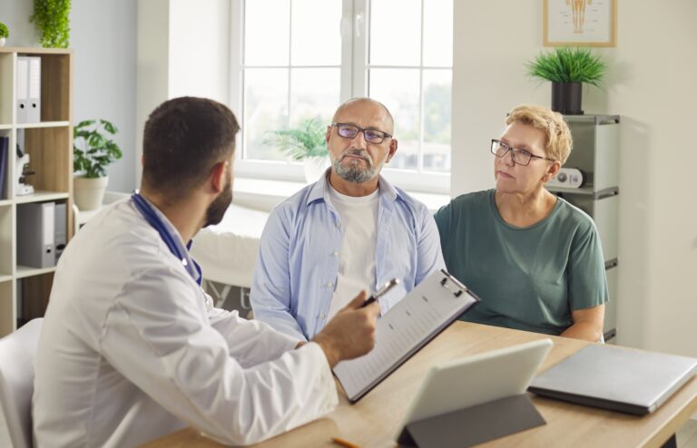 Doctor,Discusses,Treatment,And,Care,Plans,,Reviews,Records,And,Schedules