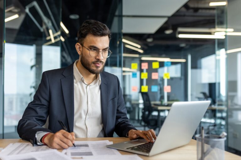 Serious,Thinking,Businessman,Doing,Paperwork,Inside,Office,,Man,Filling,Out