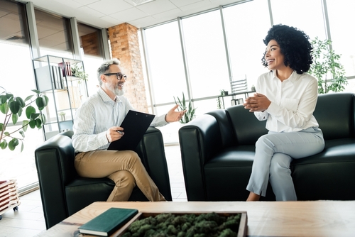 A,Business,Meeting,Between,Two,Colleagues,In,A,Modern,Office