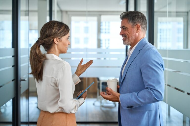 Professional,Business,Man,And,Woman,Partners,Working,Together,Having,Conversation