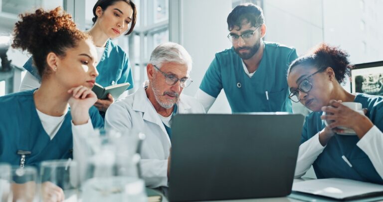 Doctor,,Nurses,And,Discussion,In,Hospital,With,Laptop,,Meeting,And